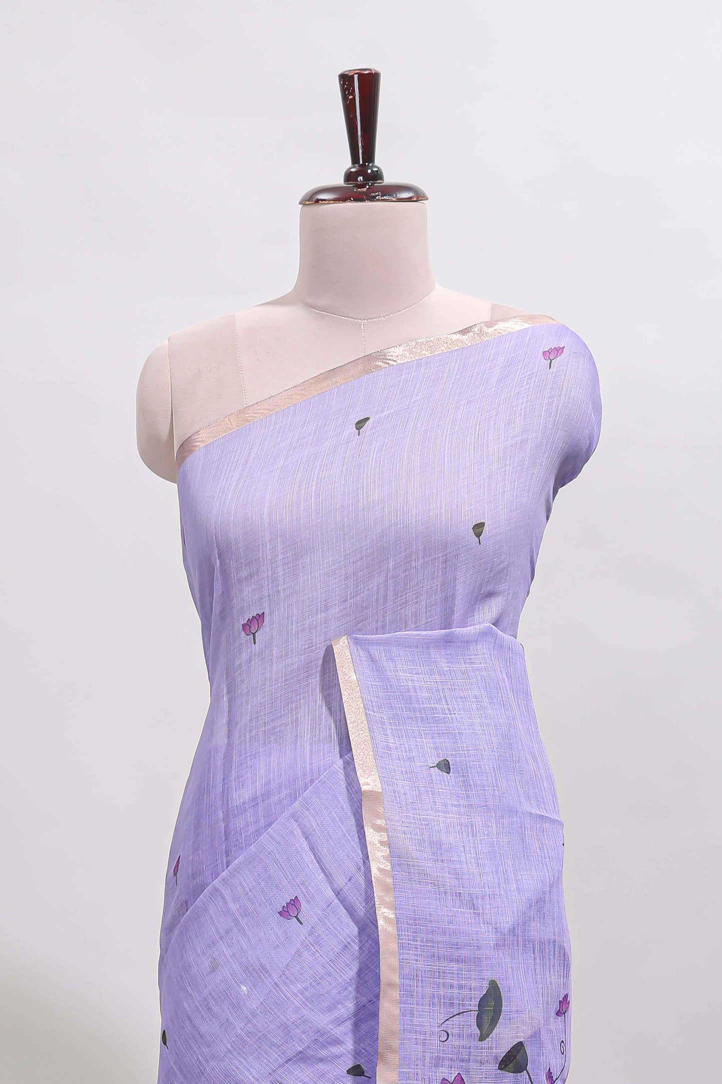 Lavender floral design linen cotton saree with self zari border, matching pallu and contrast blouse