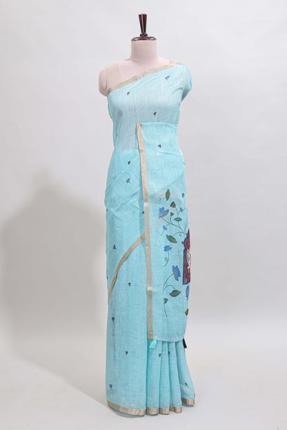 Blue floral design linen cotton saree with self zari border, matching pallu and contrast blouse
