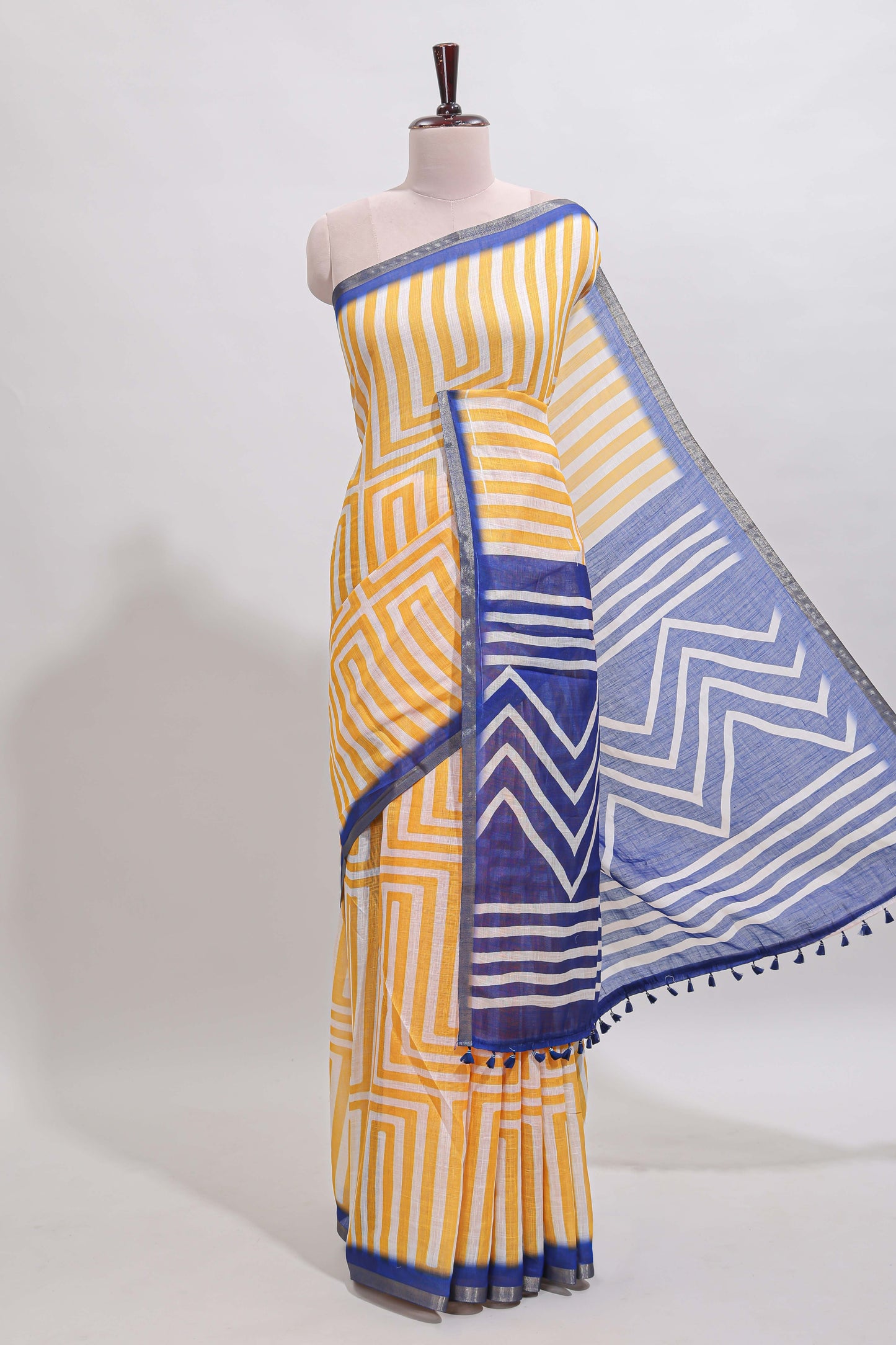 Yellow geometric design linen cotton saree with contrast zari border and pallu