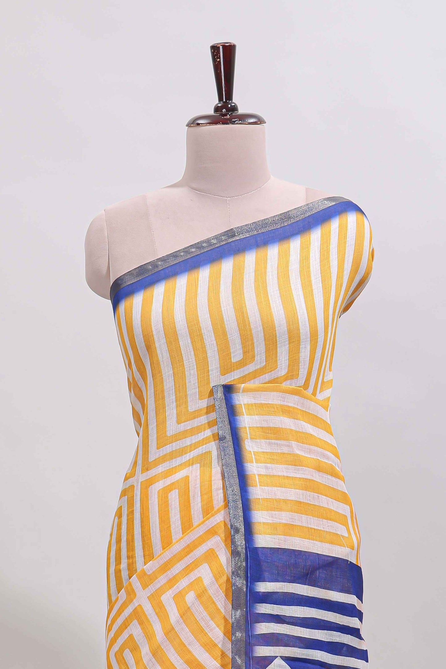 Yellow geometric design linen cotton saree with contrast zari border and pallu