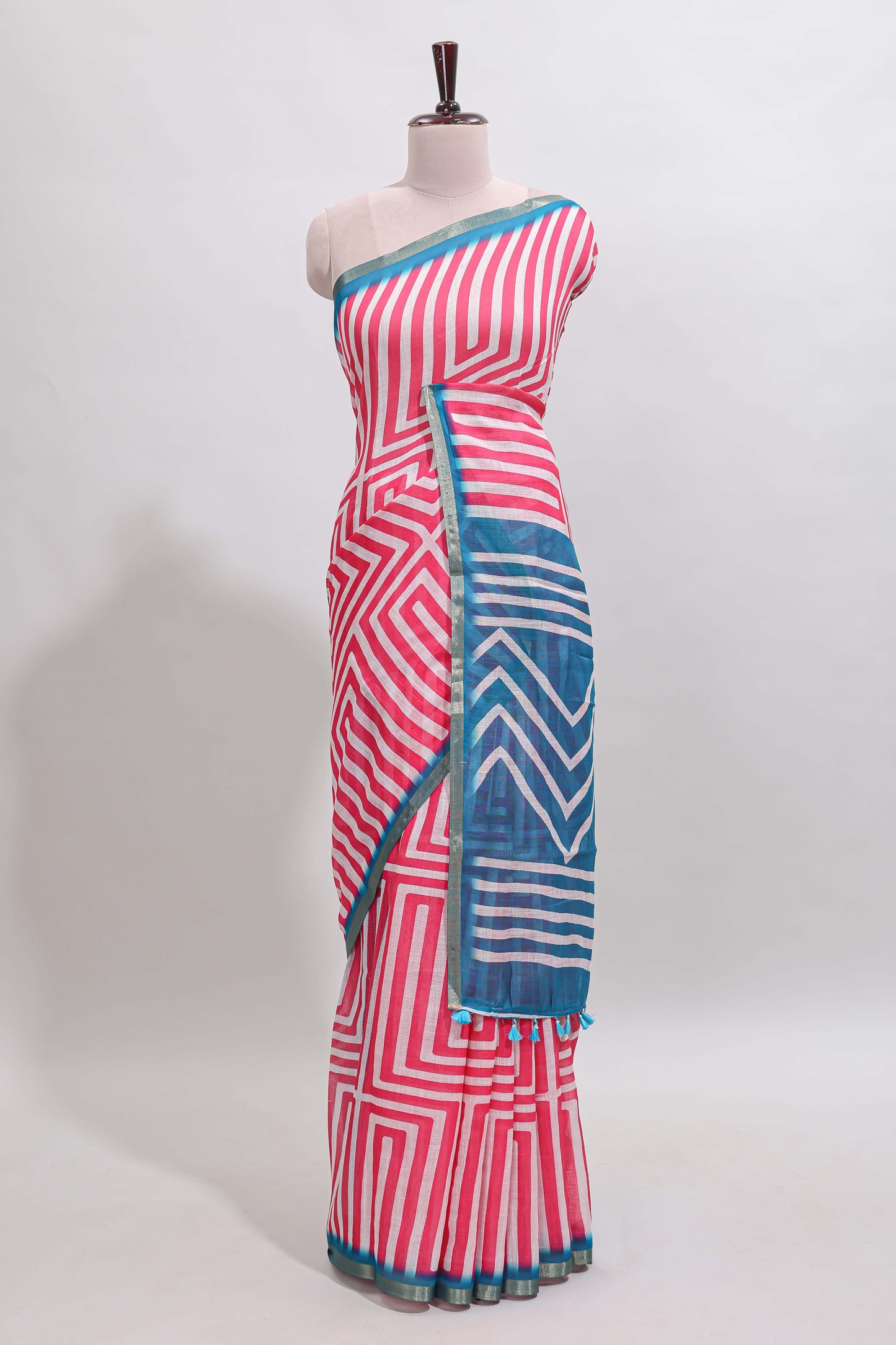 Peach geometric design linen cotton saree with contrast zari border and pallu