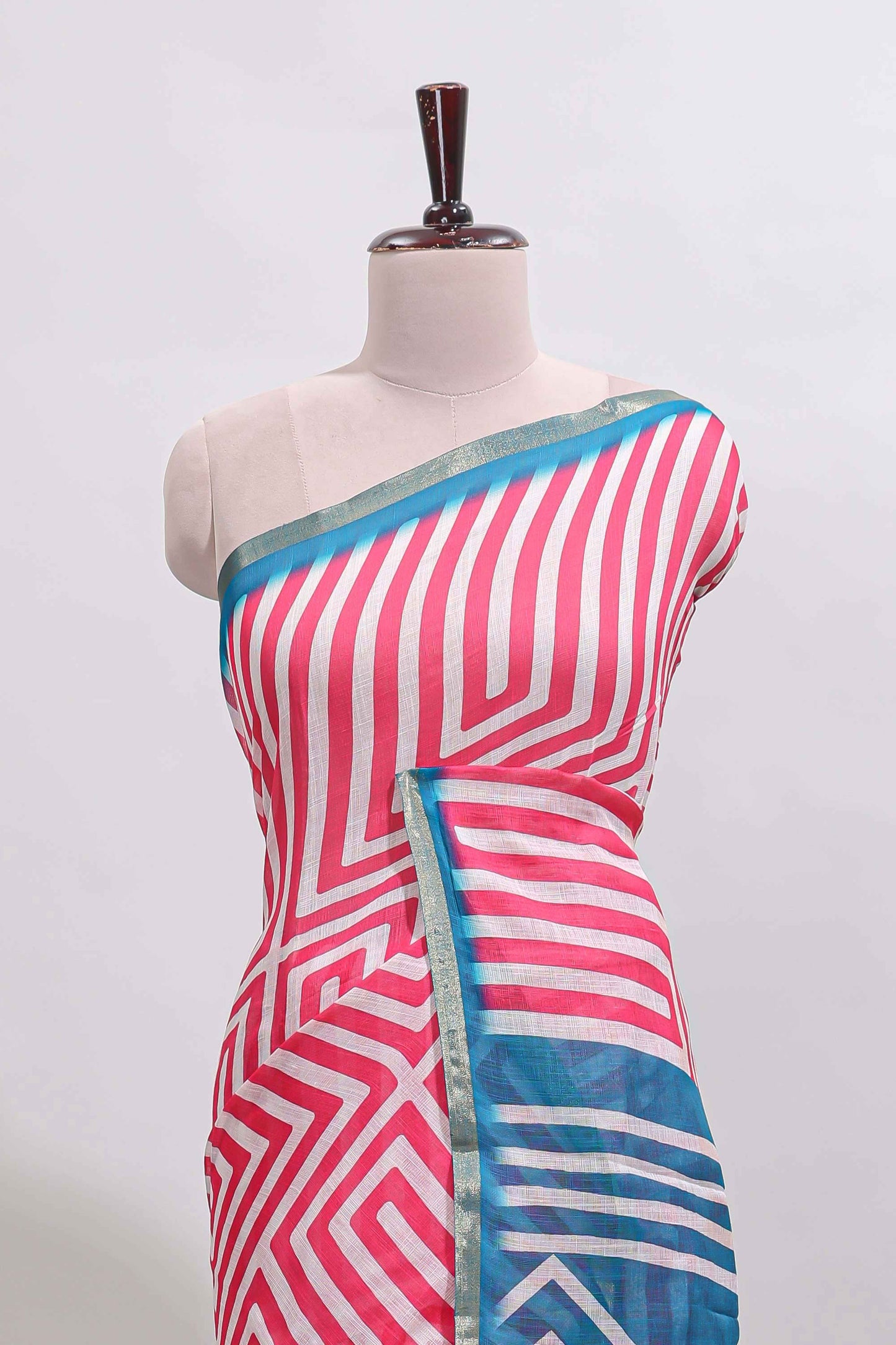 Peach geometric design linen cotton saree with contrast zari border and pallu