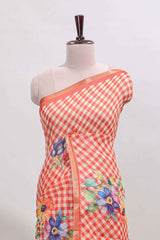 Orange checked floral design linen cotton saree with self zari border and matching blouse