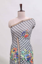 Grey checked floral design linen cotton saree with self zari border and matching blouse