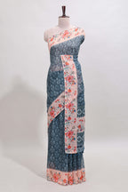 Midnight green floral design linen cotton saree with contrast floral design border and matching blouse