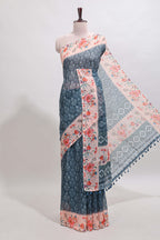 Midnight green floral design linen cotton saree with contrast floral design border and matching blouse