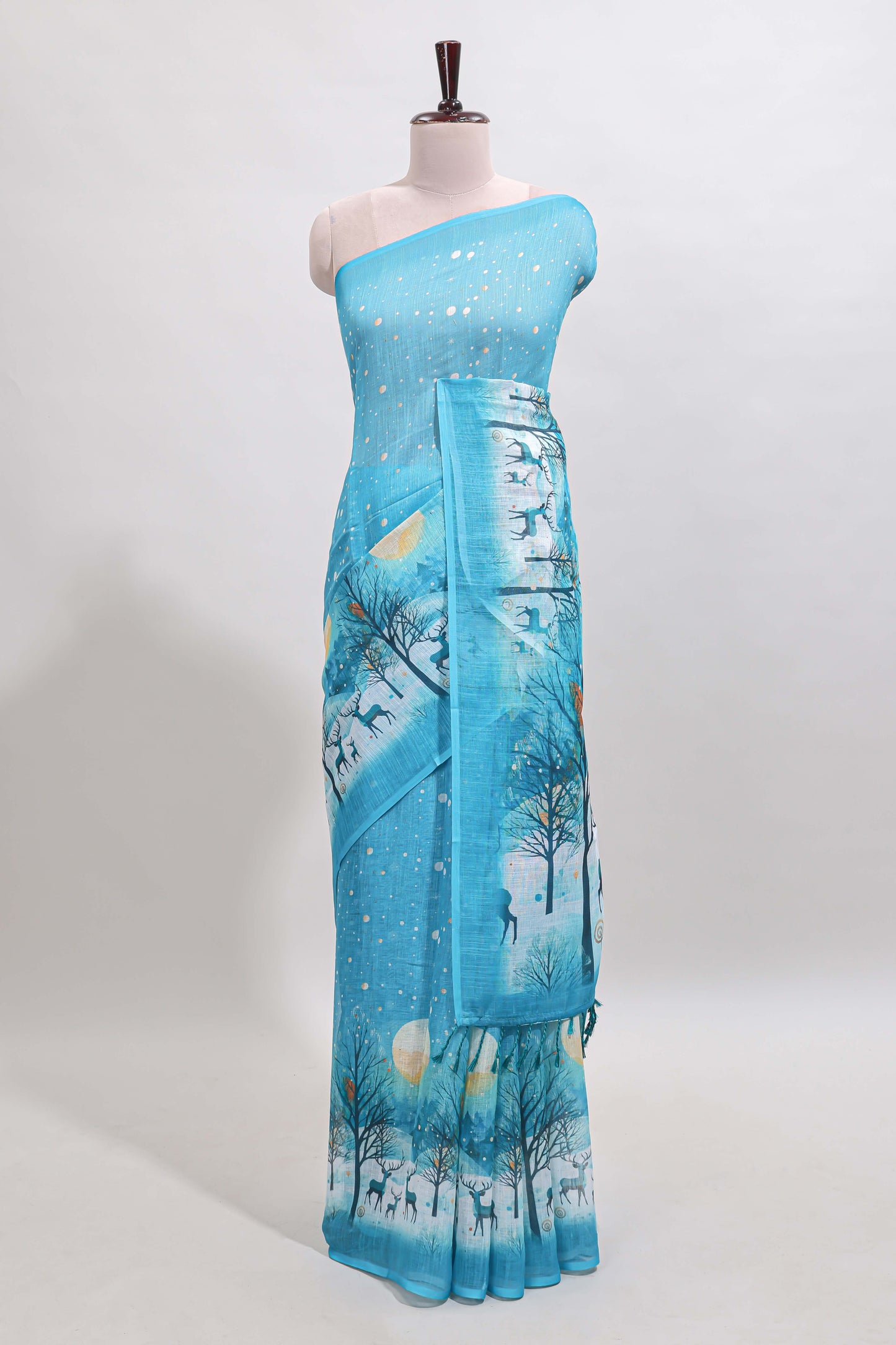 Turquoise blue winter themed linen cotton saree with self border and matching blouse