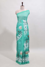 Turquoise green winter themed linen cotton saree with self border and matching blouse