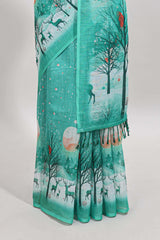 Turquoise green winter themed linen cotton saree with self border and matching blouse
