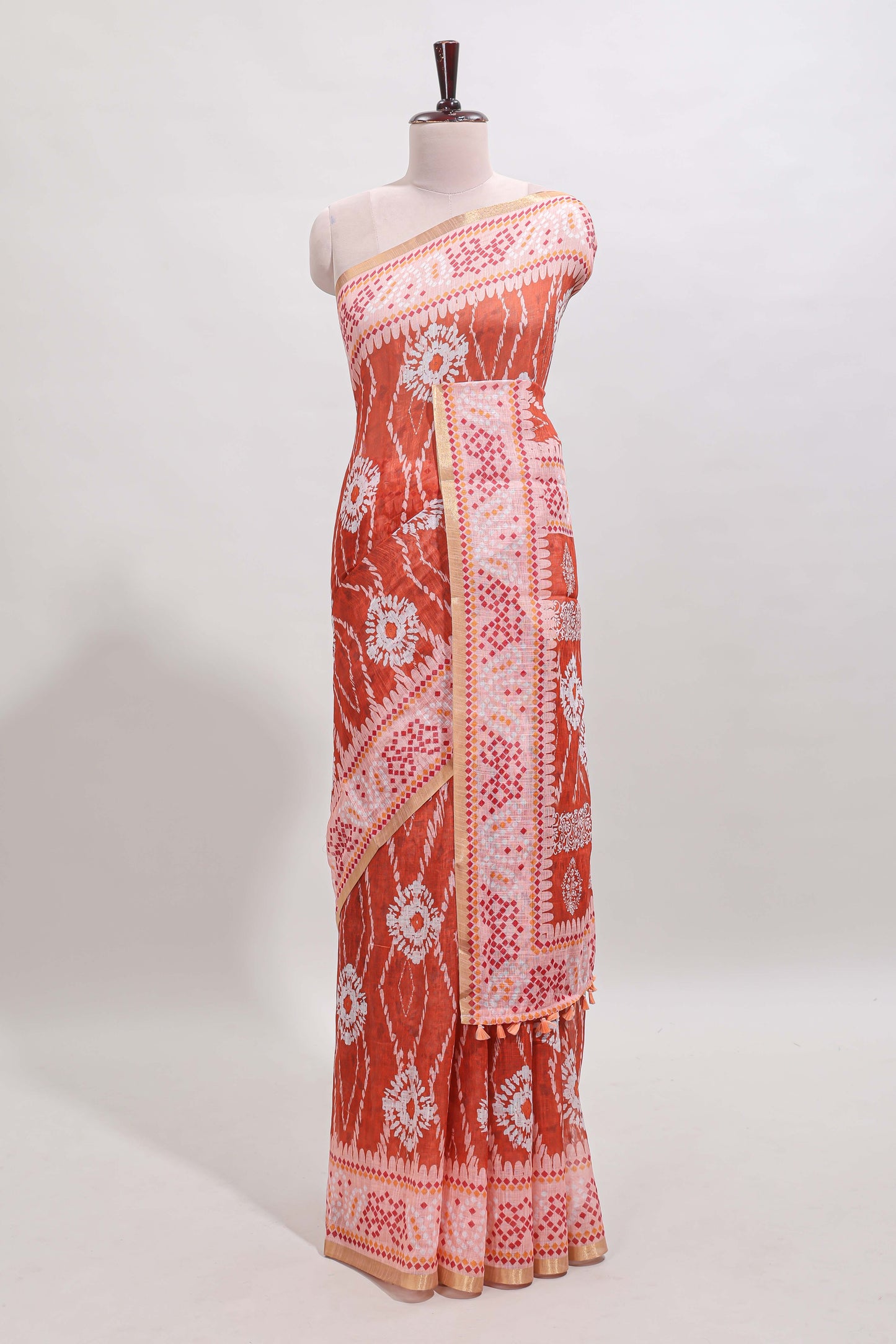 Orange shibori print motifs linen cotton saree with contrast border and matching blouse