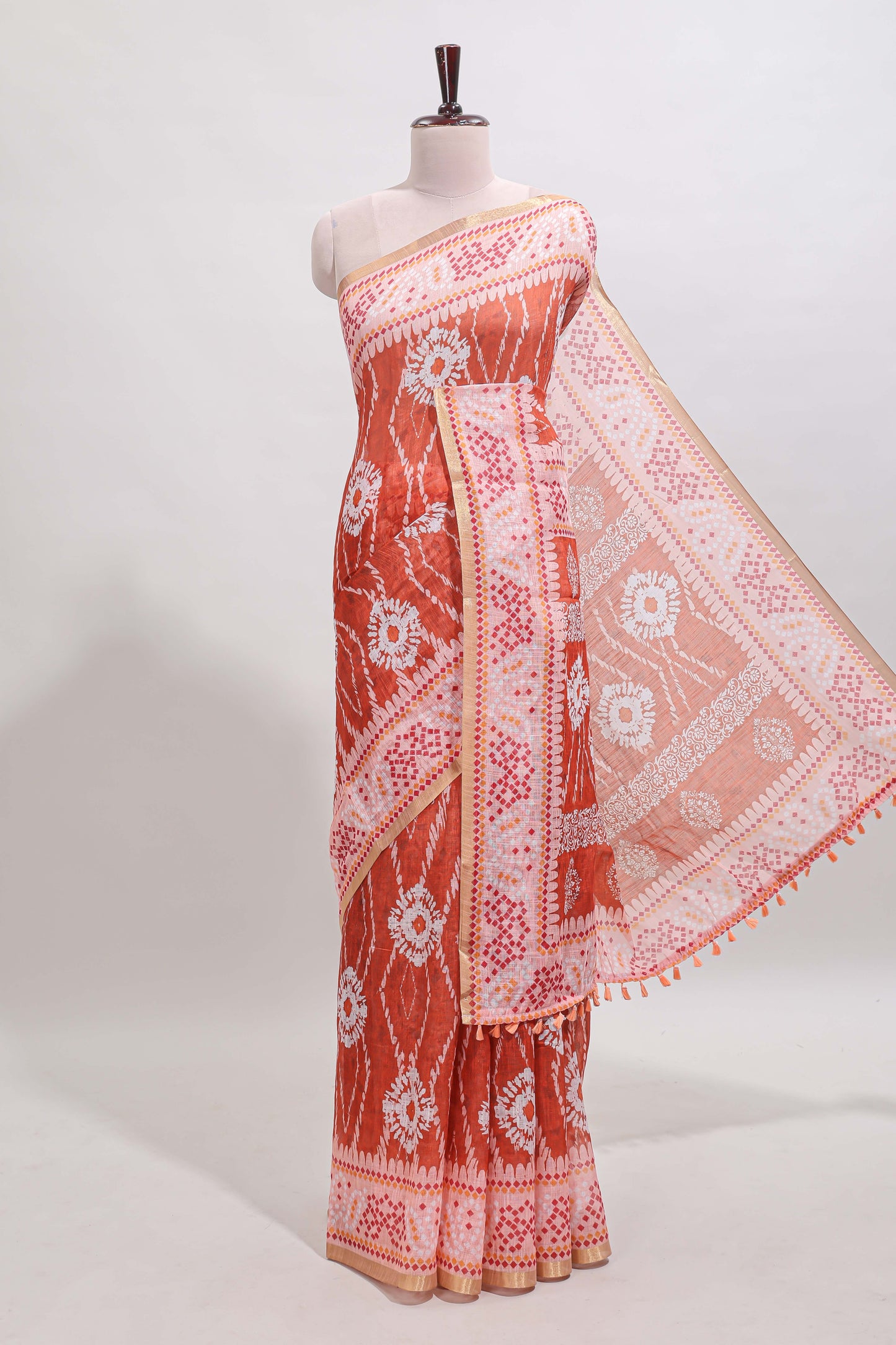 Orange shibori print motifs linen cotton saree with contrast border and matching blouse