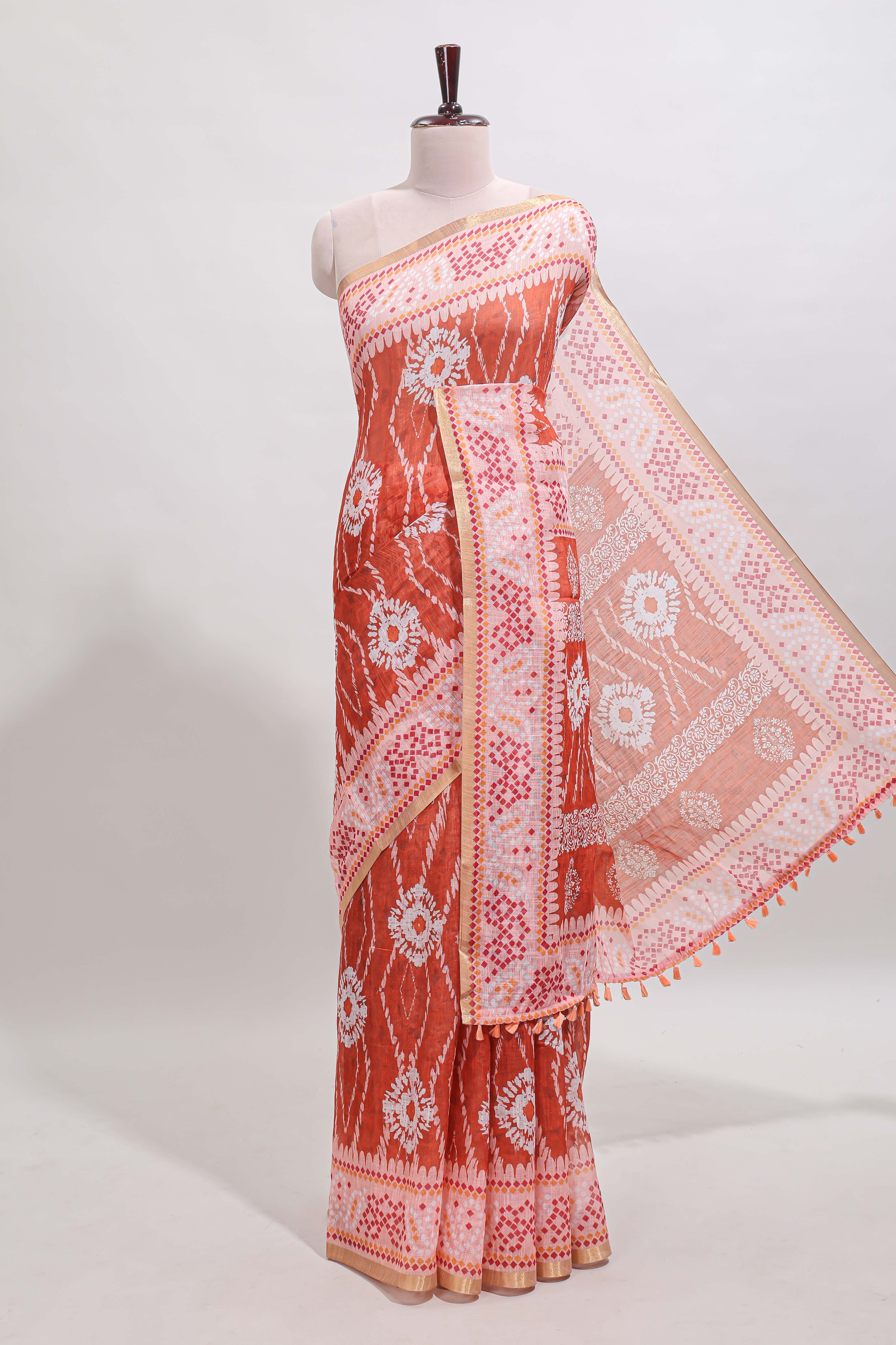 Orange shibori print motifs linen cotton saree with contrast border and matching blouse