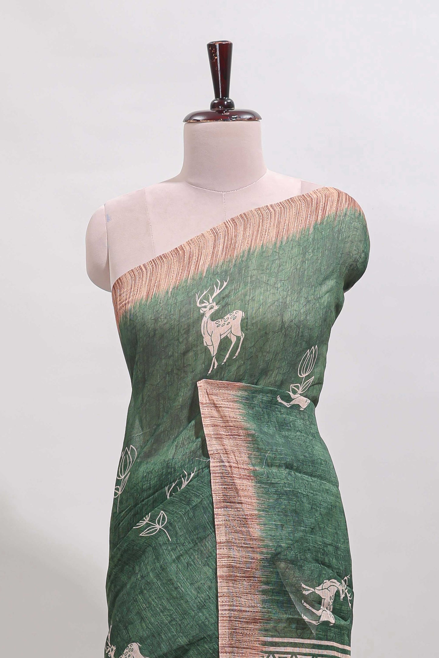 Green floral & deer design motifs linen cotton saree with contrast border and matching printed blouse