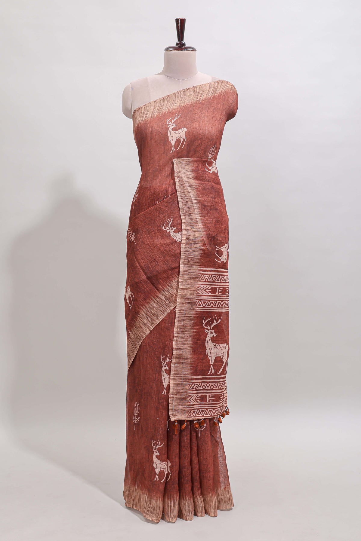 Orange floral & deer design motifs linen cotton saree with contrast border and matching printed blouse