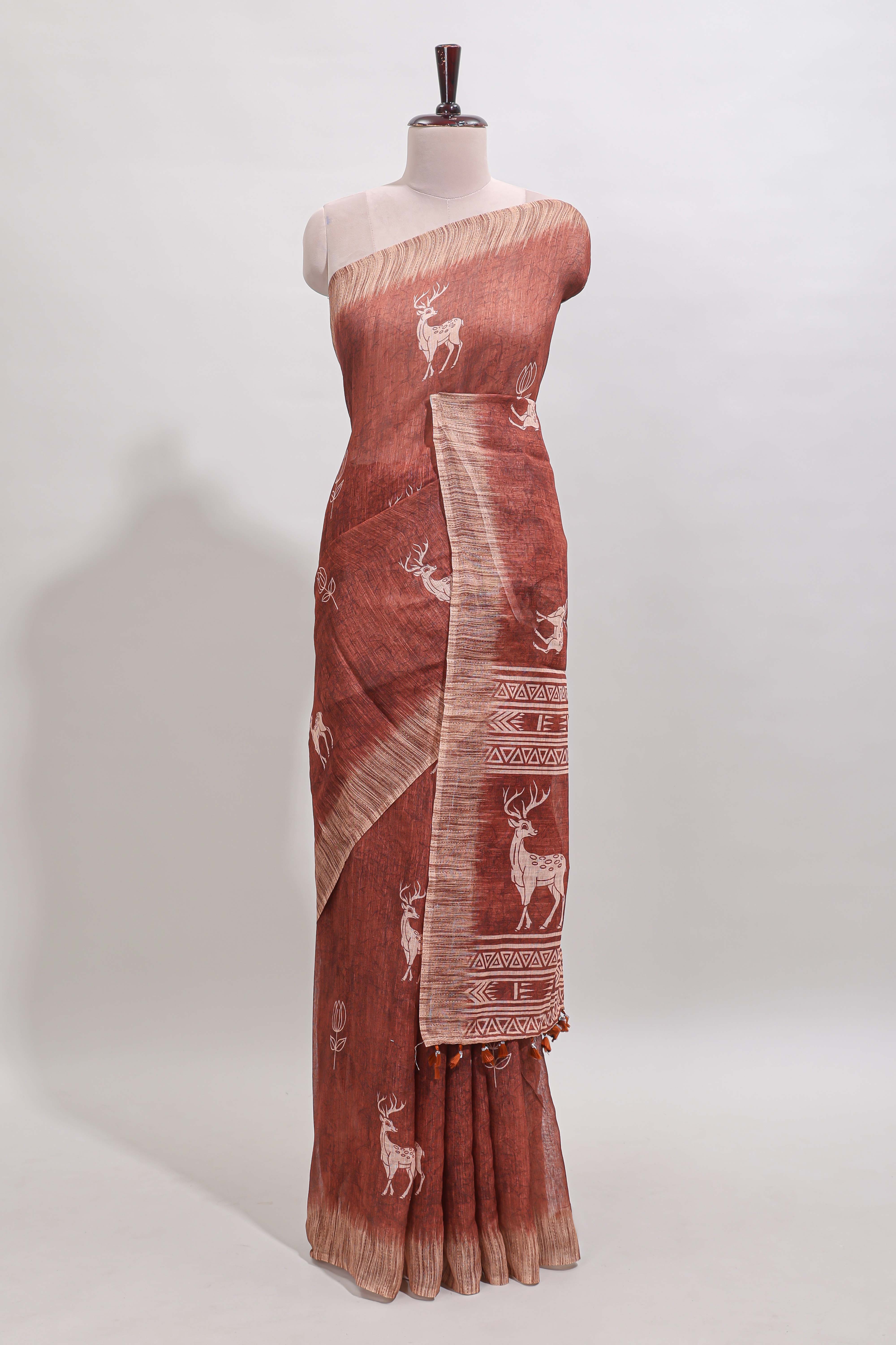Orange floral & deer design motifs linen cotton saree with contrast border and matching printed blouse