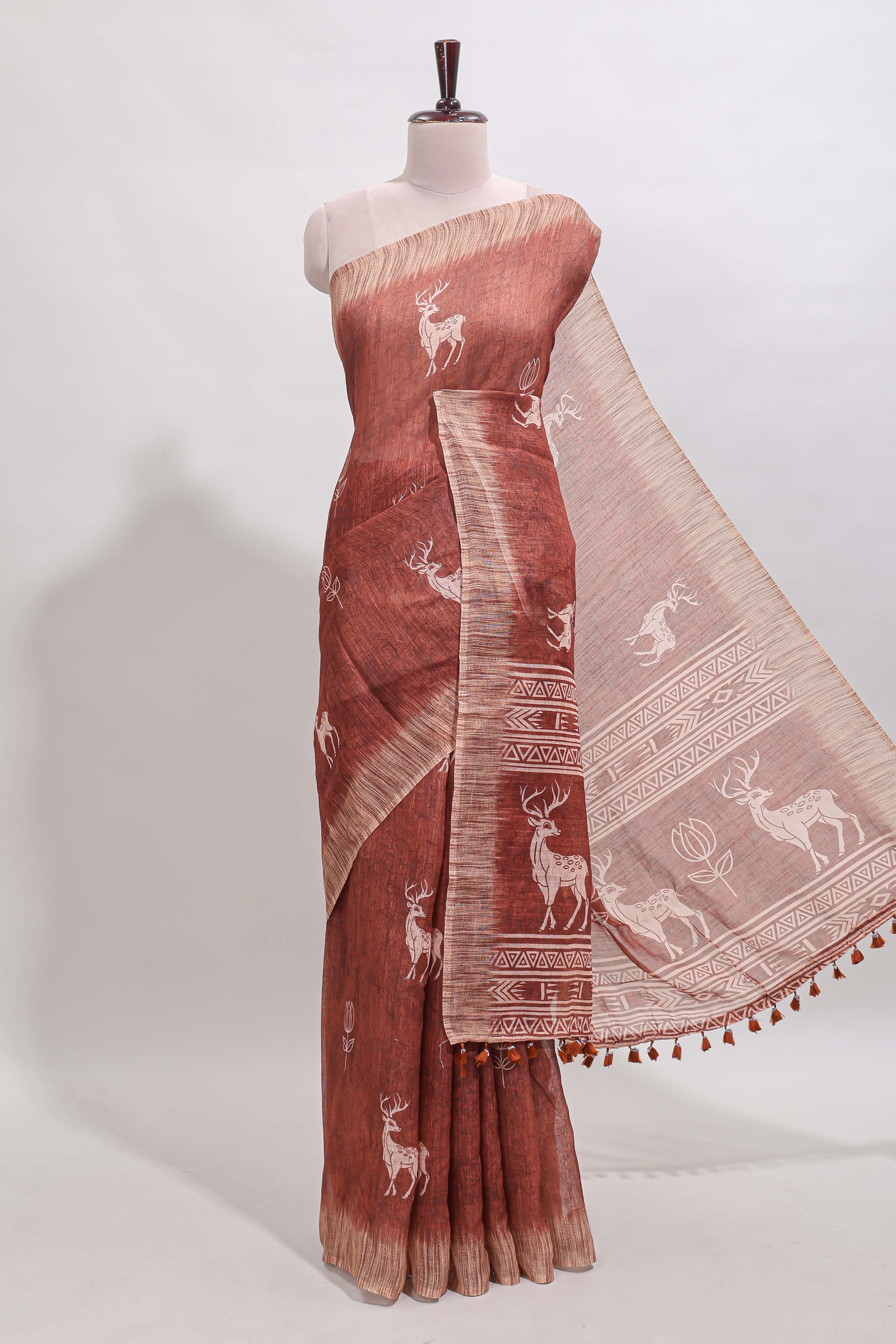 Orange floral & deer design motifs linen cotton saree with contrast border and matching printed blouse