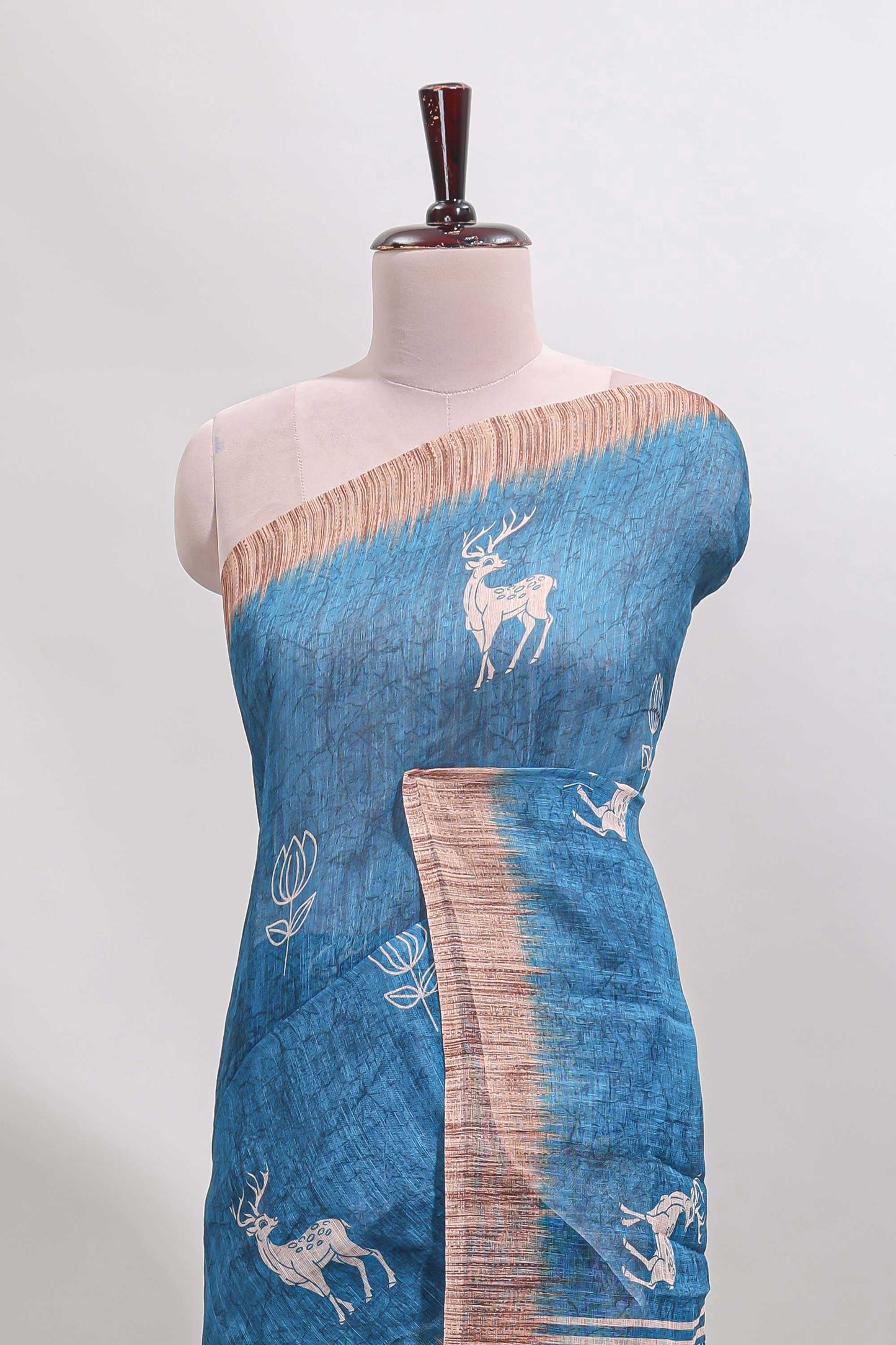 Blue floral & deer design motifs linen cotton saree with contrast border and matching printed blouse