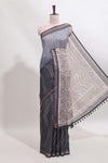 Grey checked geometric design butta linen cotton saree with self zari border and contrast blouse
