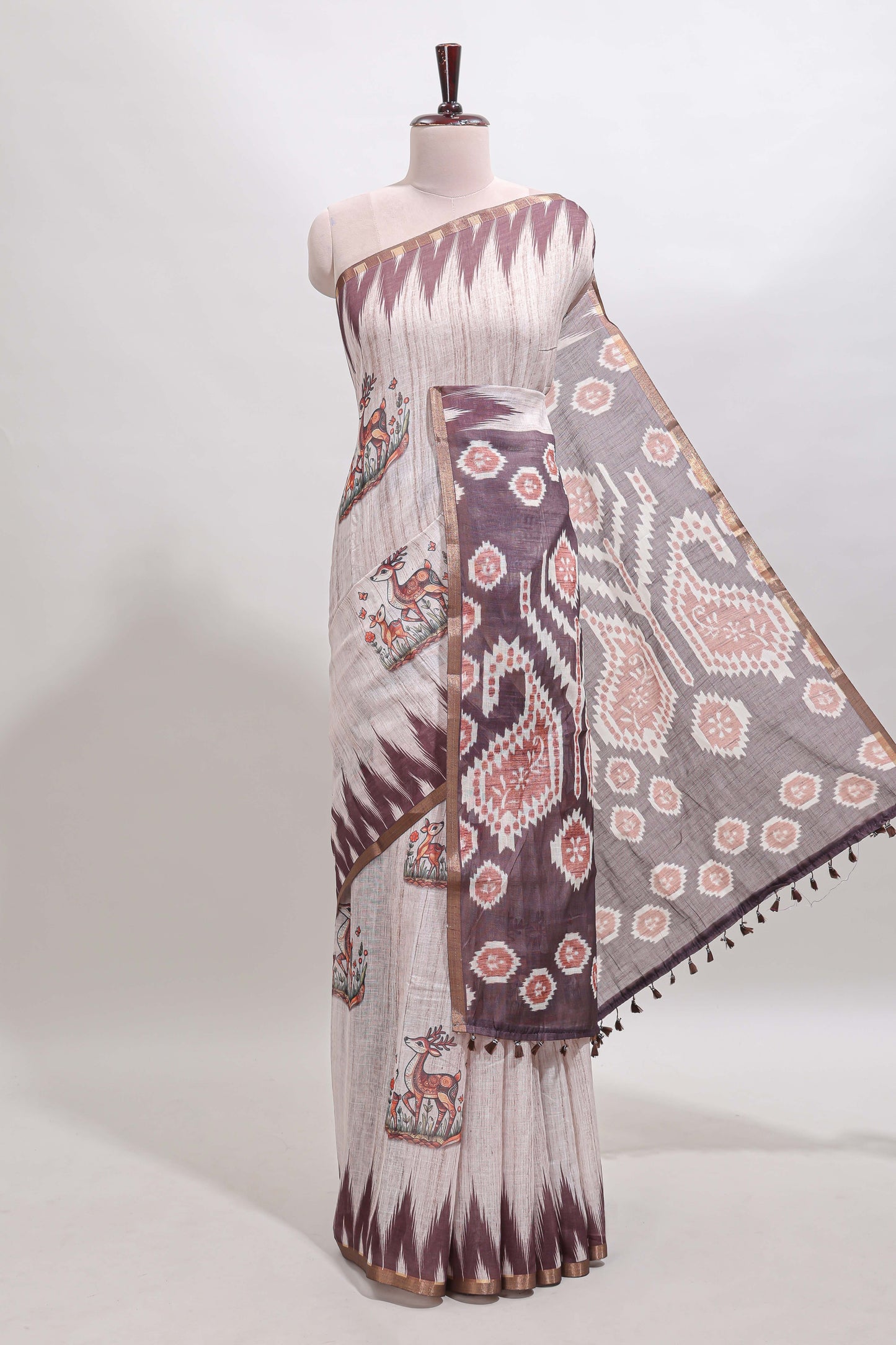 Brown deer & fawn motifs linen cotton saree with self zari border and contrast ikkat style pallu