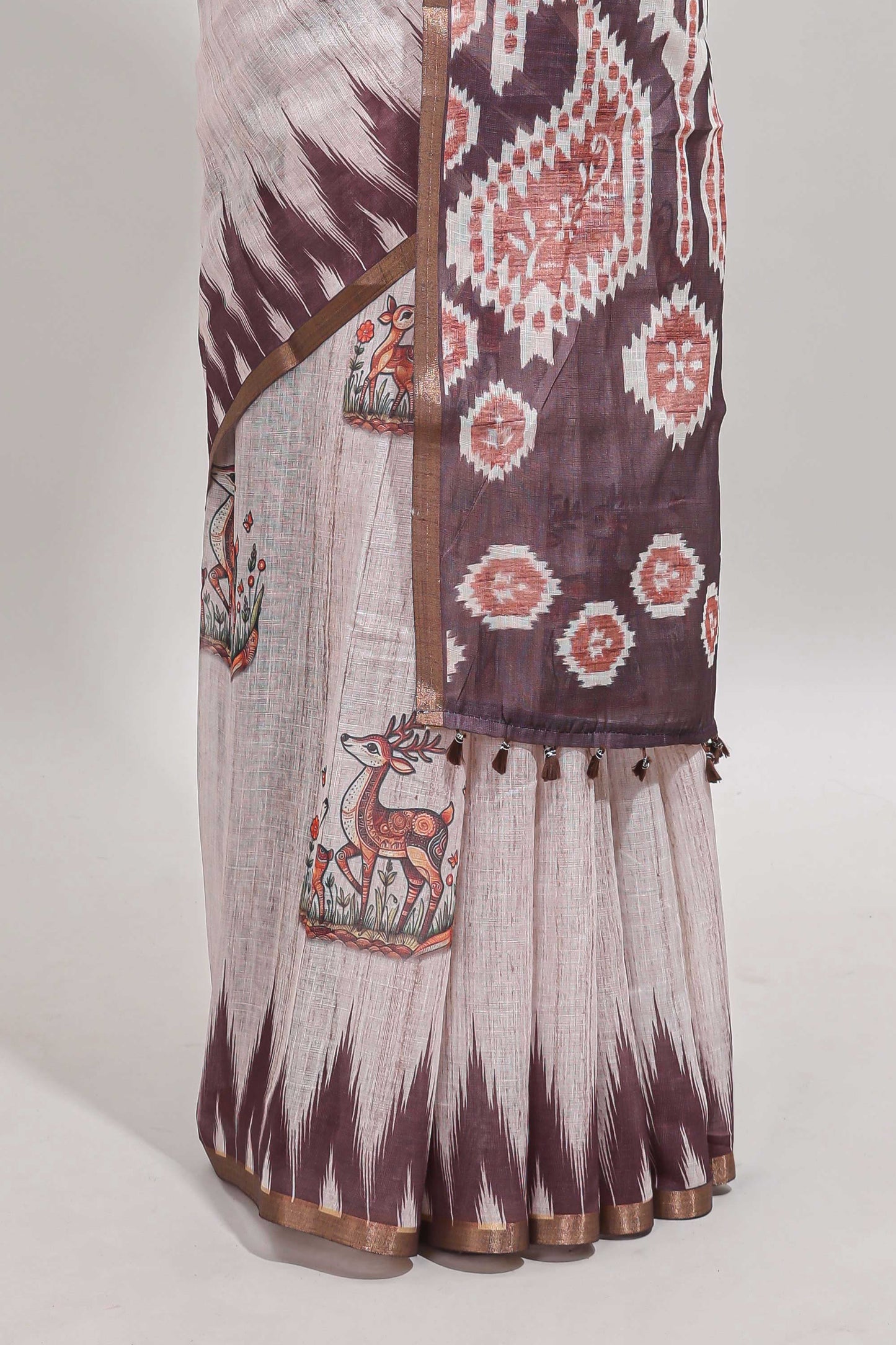 Brown deer & fawn motifs linen cotton saree with self zari border and contrast ikkat style pallu