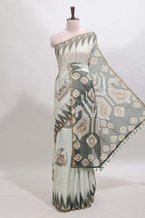 Green deer & fawn motifs linen cotton saree with self zari border and contrast ikkat style pallu