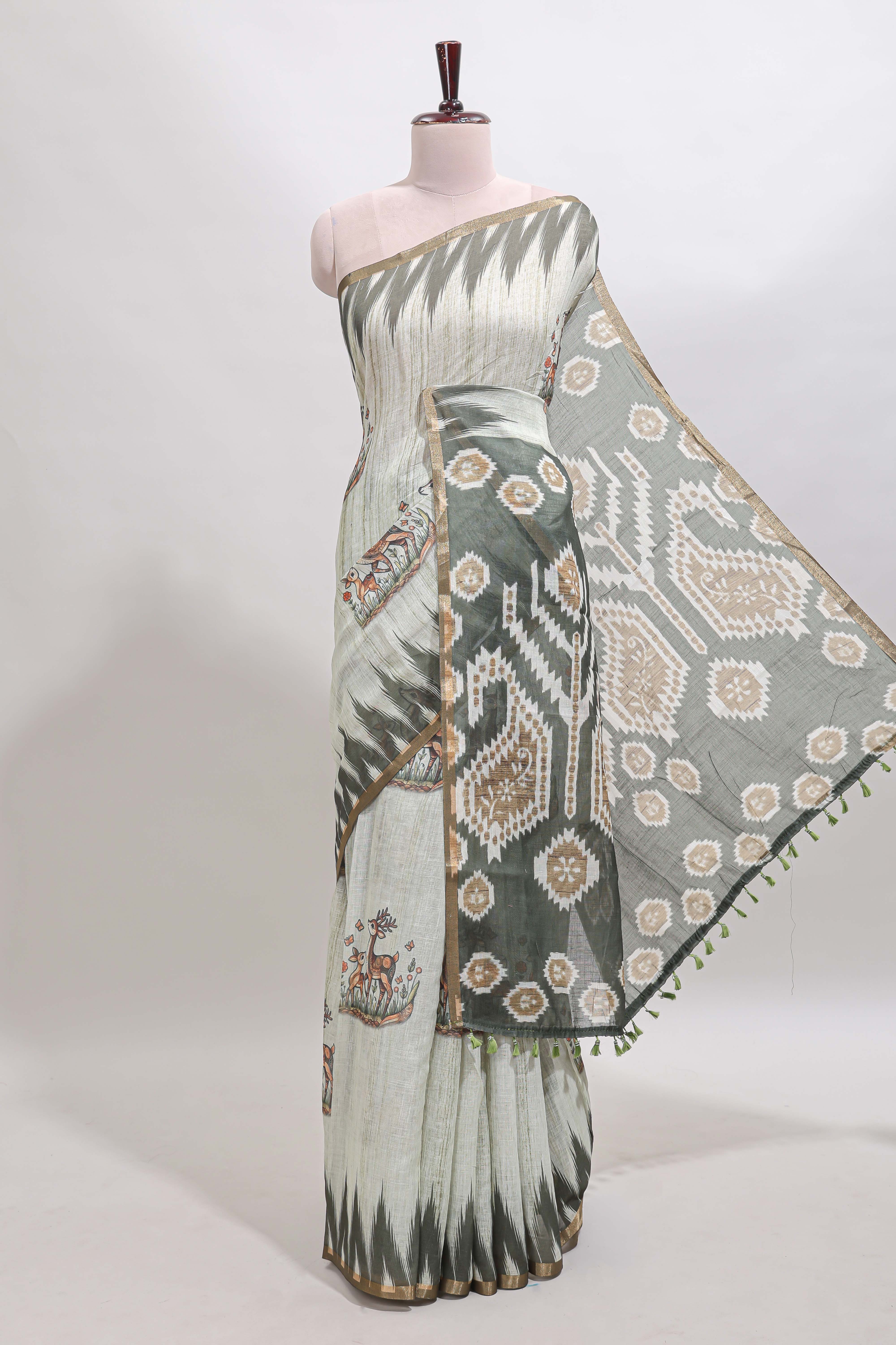 Green deer & fawn motifs linen cotton saree with self zari border and contrast ikkat style pallu