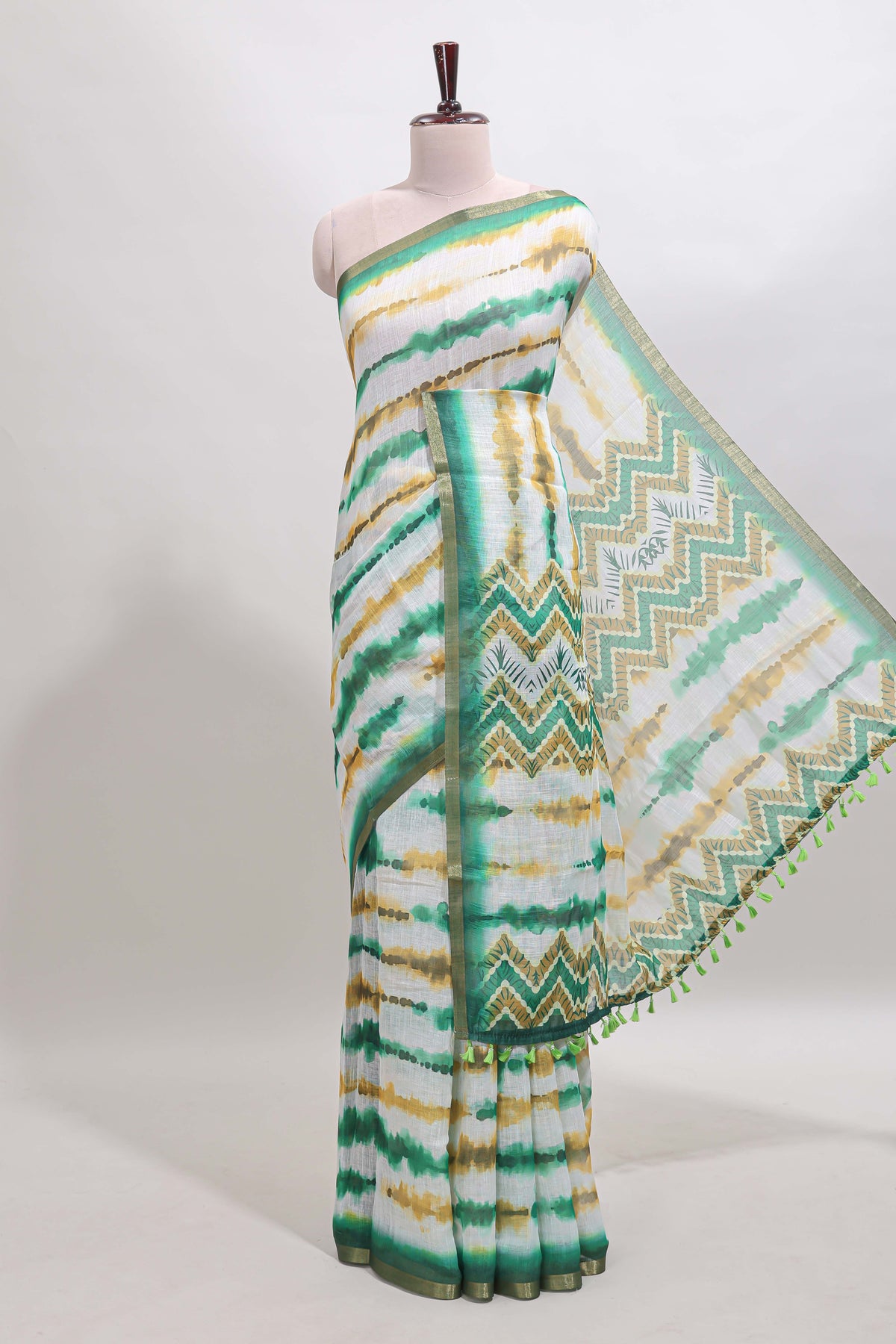 White tie & dye striped linen cotton saree with contrast zari border and printed blouse