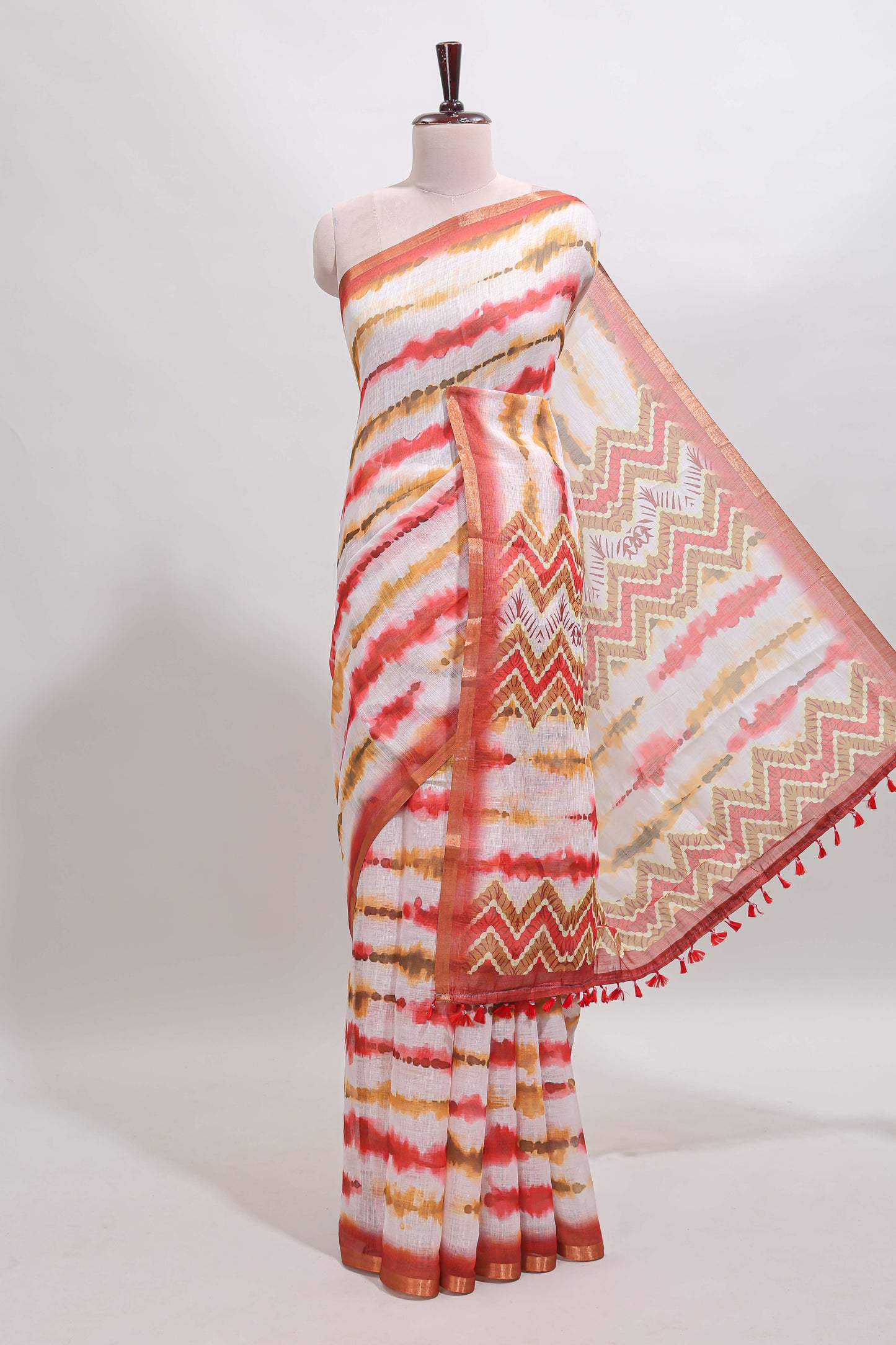 White tie & dye striped linen cotton saree with contrast zari border and printed blouse
