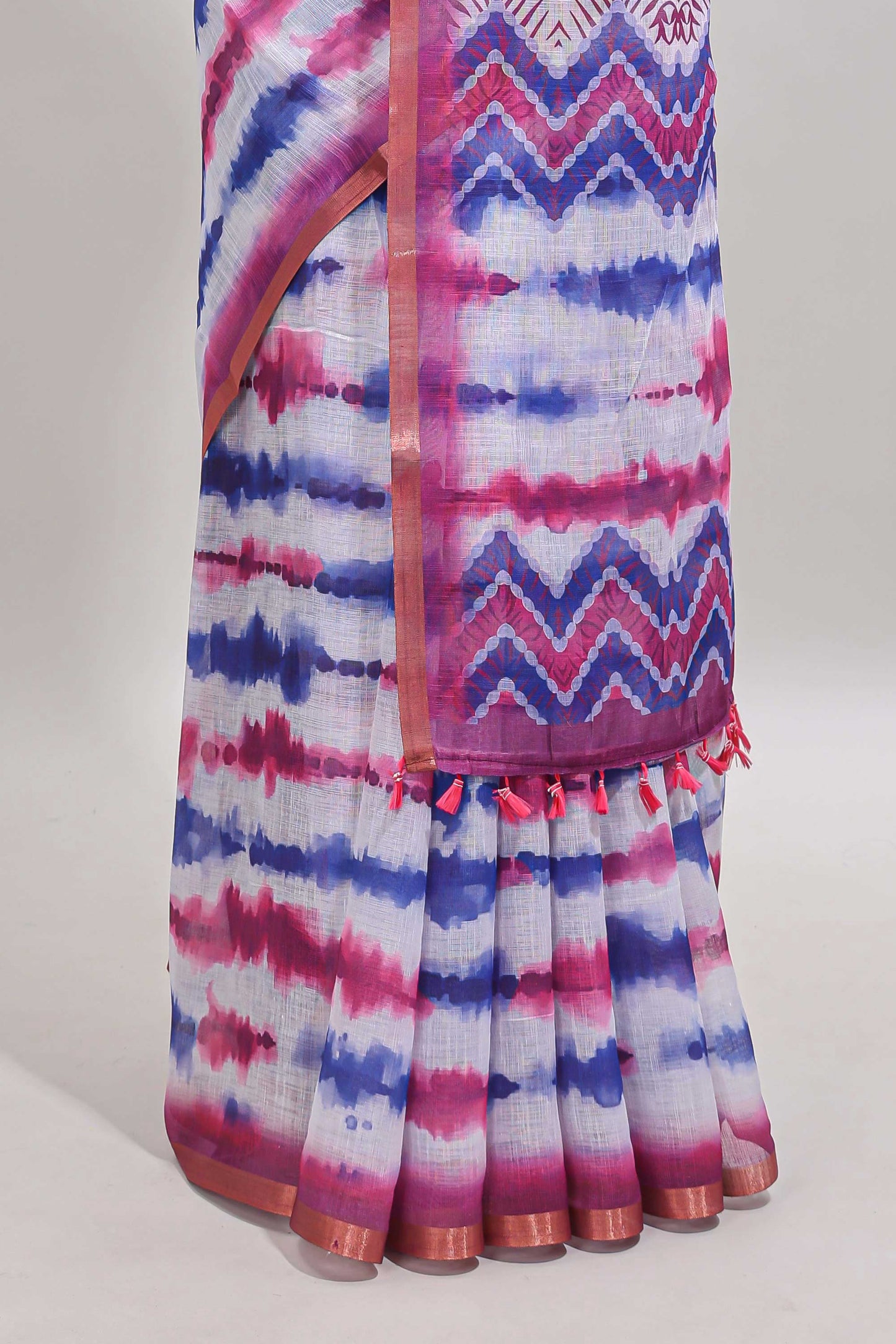 White tie & dye striped linen cotton saree with contrast zari border and printed blouse