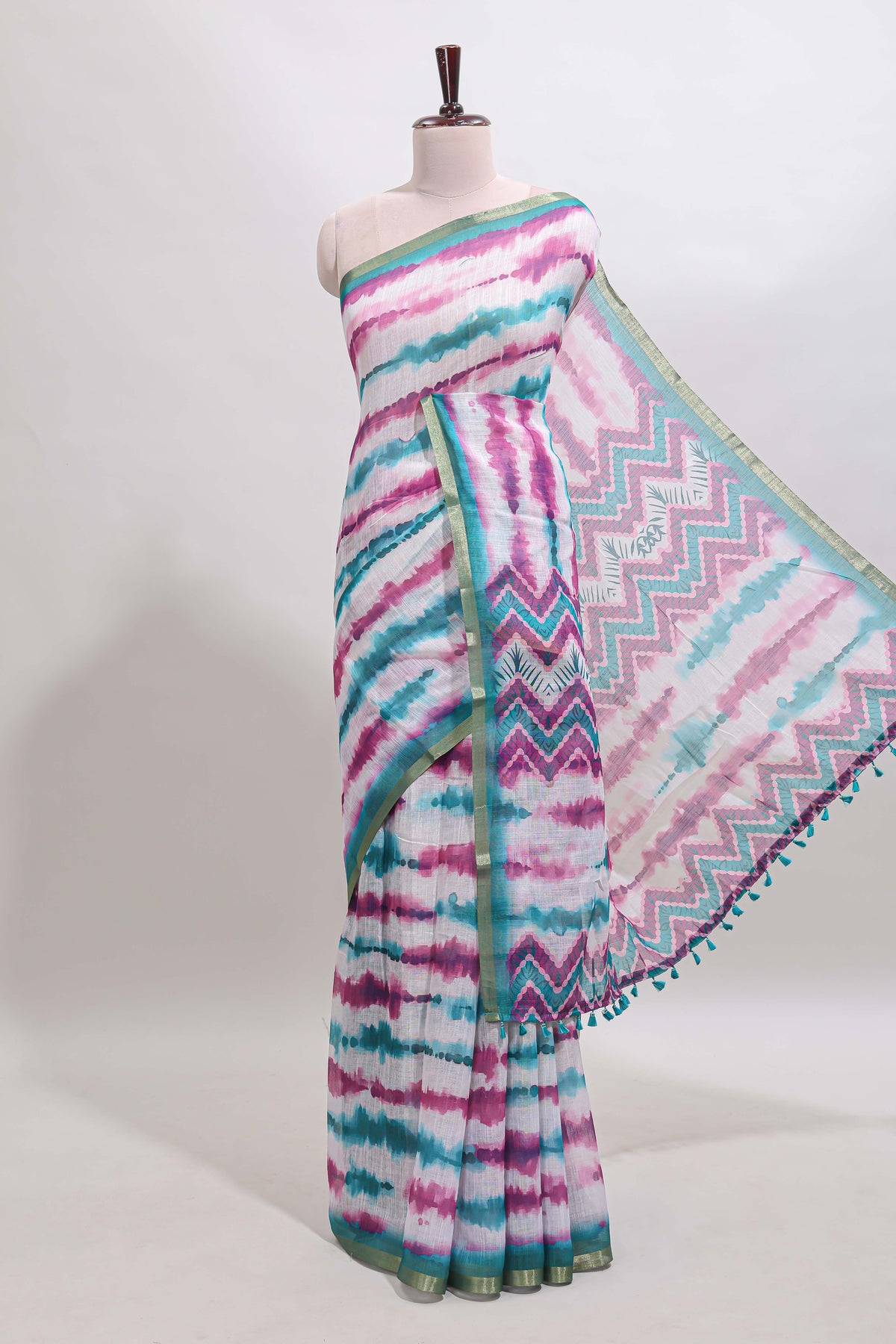 White tie & dye striped linen cotton saree with contrast zari border and printed blouse