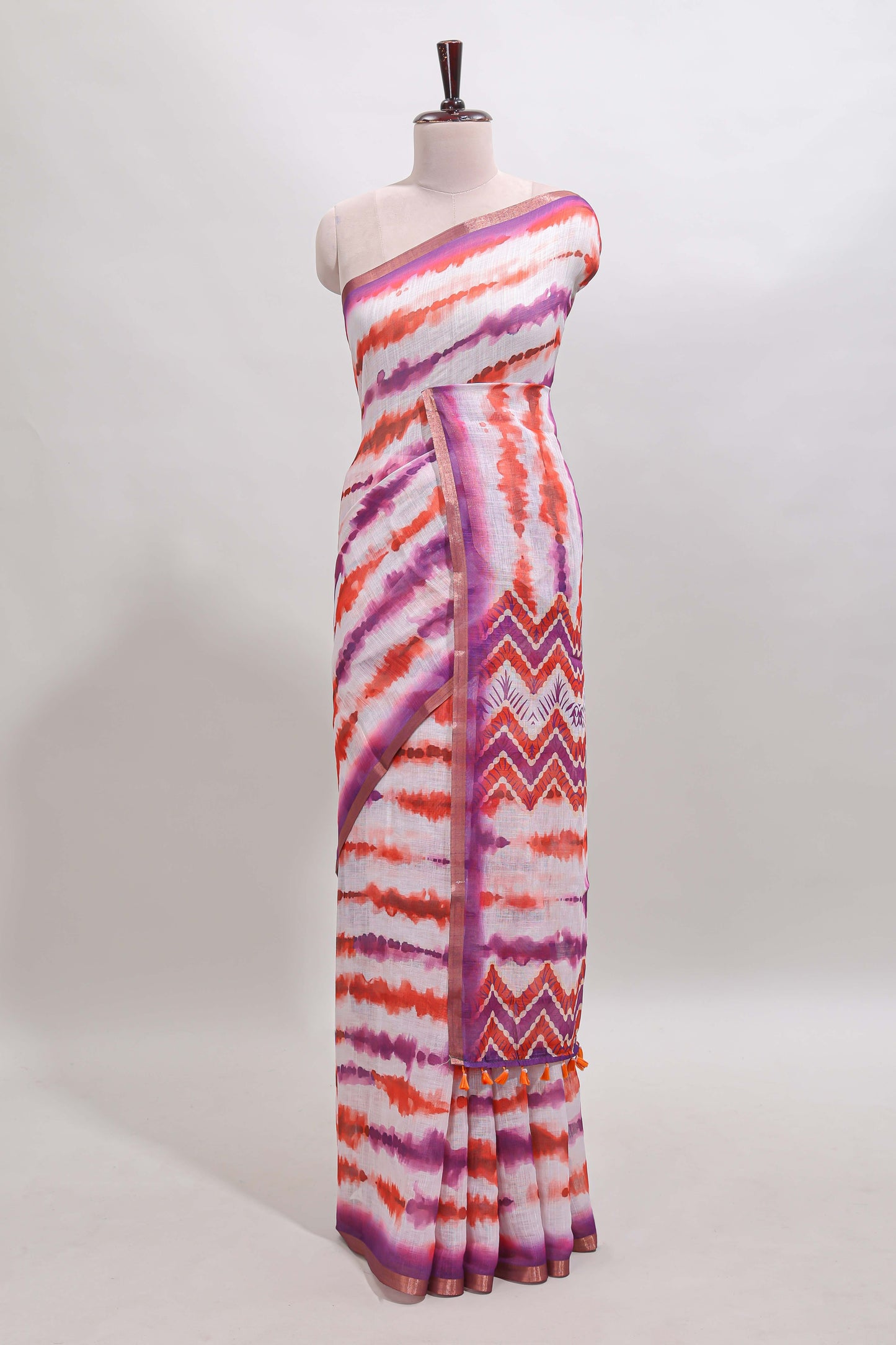 White tie & dye striped linen cotton saree with contrast zari border and printed blouse