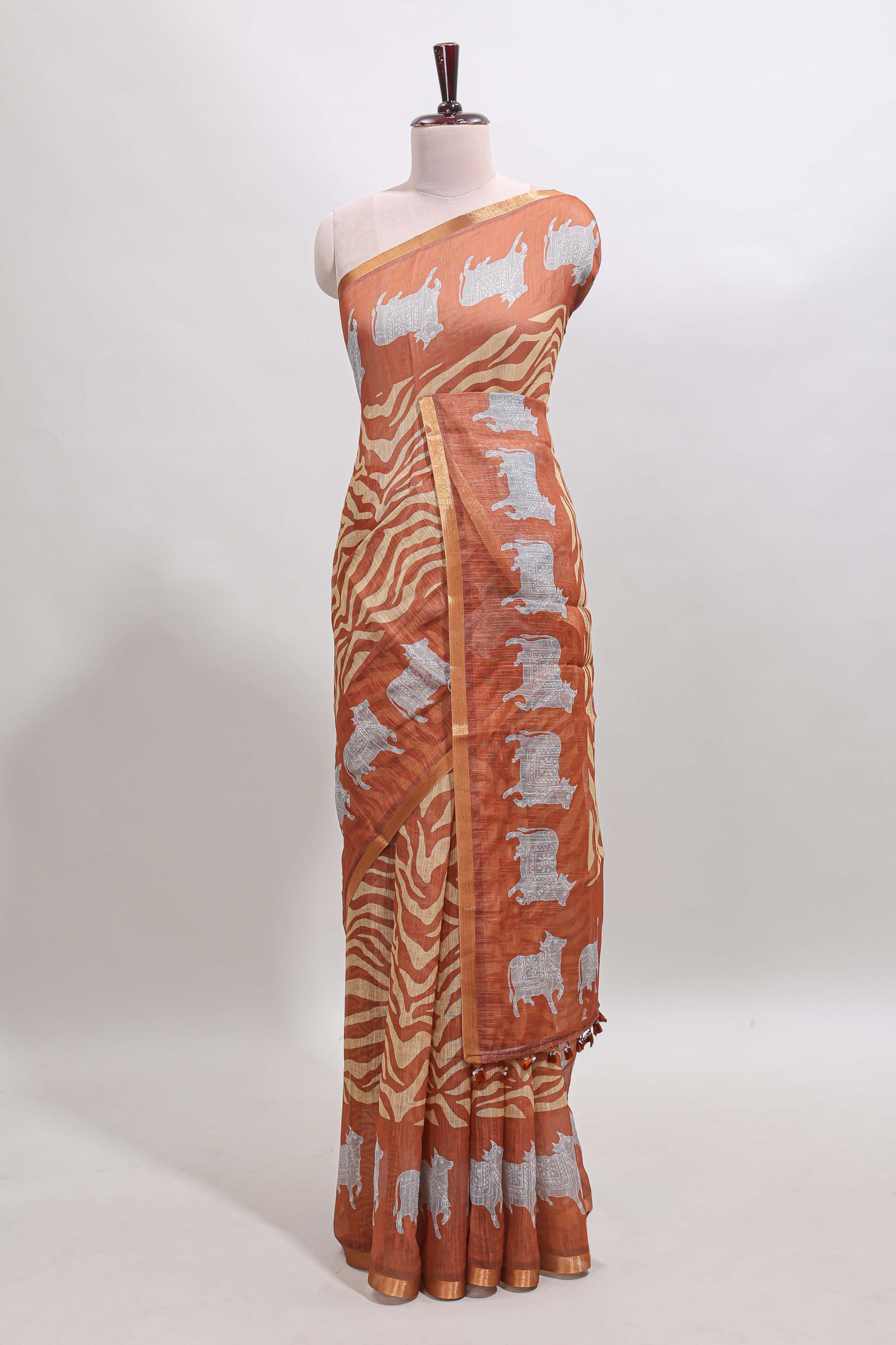 Brown pichwai cow prints & Zebra inspired pattern linen cotton saree with self zari border and matching blouse