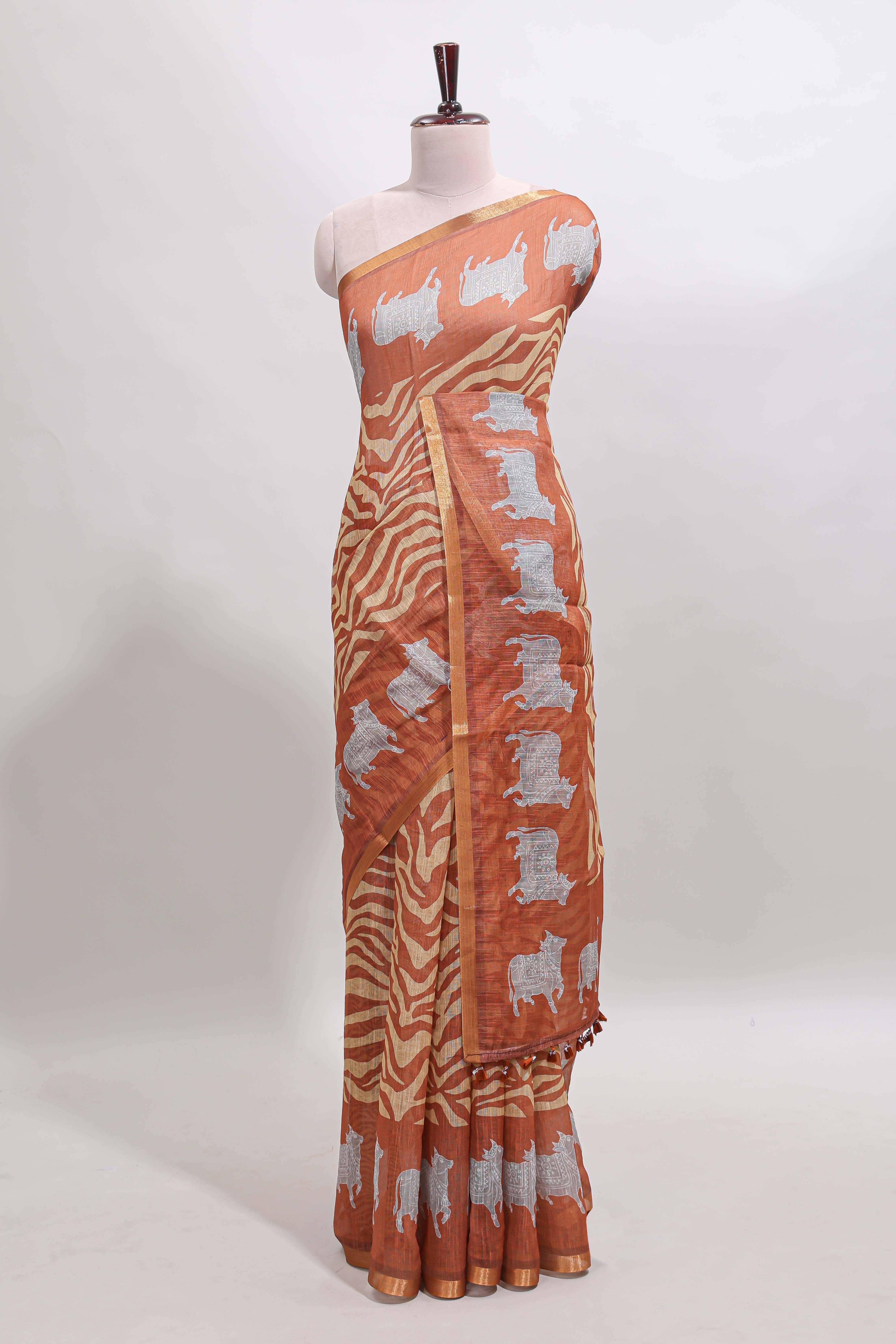 Brown pichwai cow prints & Zebra inspired pattern linen cotton saree with self zari border and matching blouse