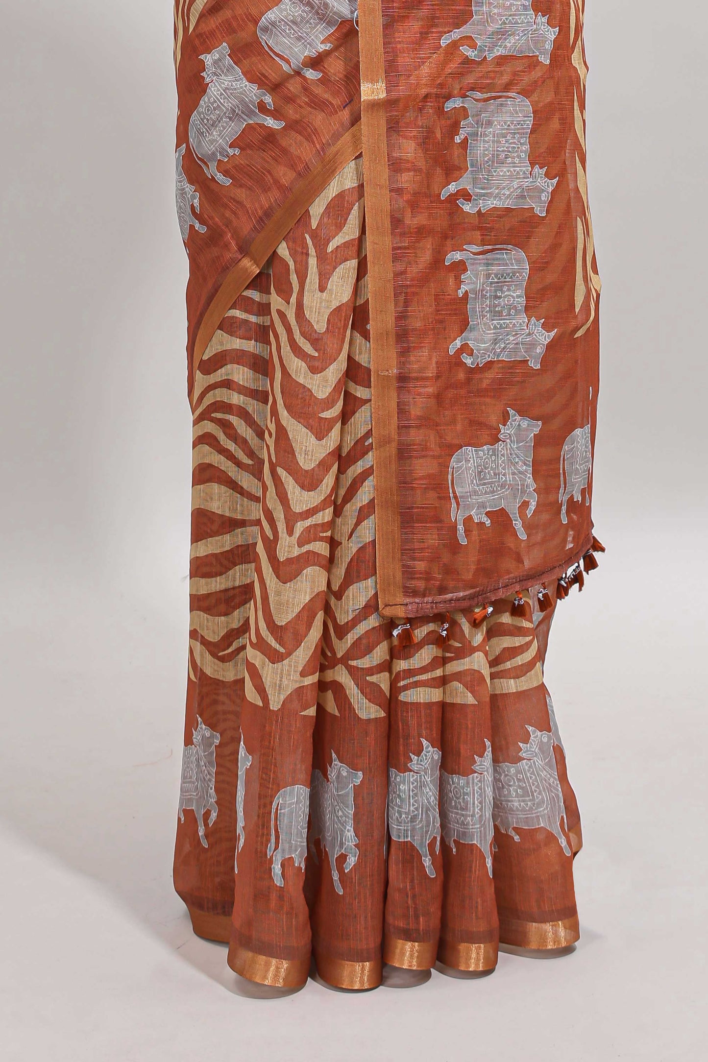 Brown pichwai cow prints & Zebra inspired pattern linen cotton saree with self zari border and matching blouse