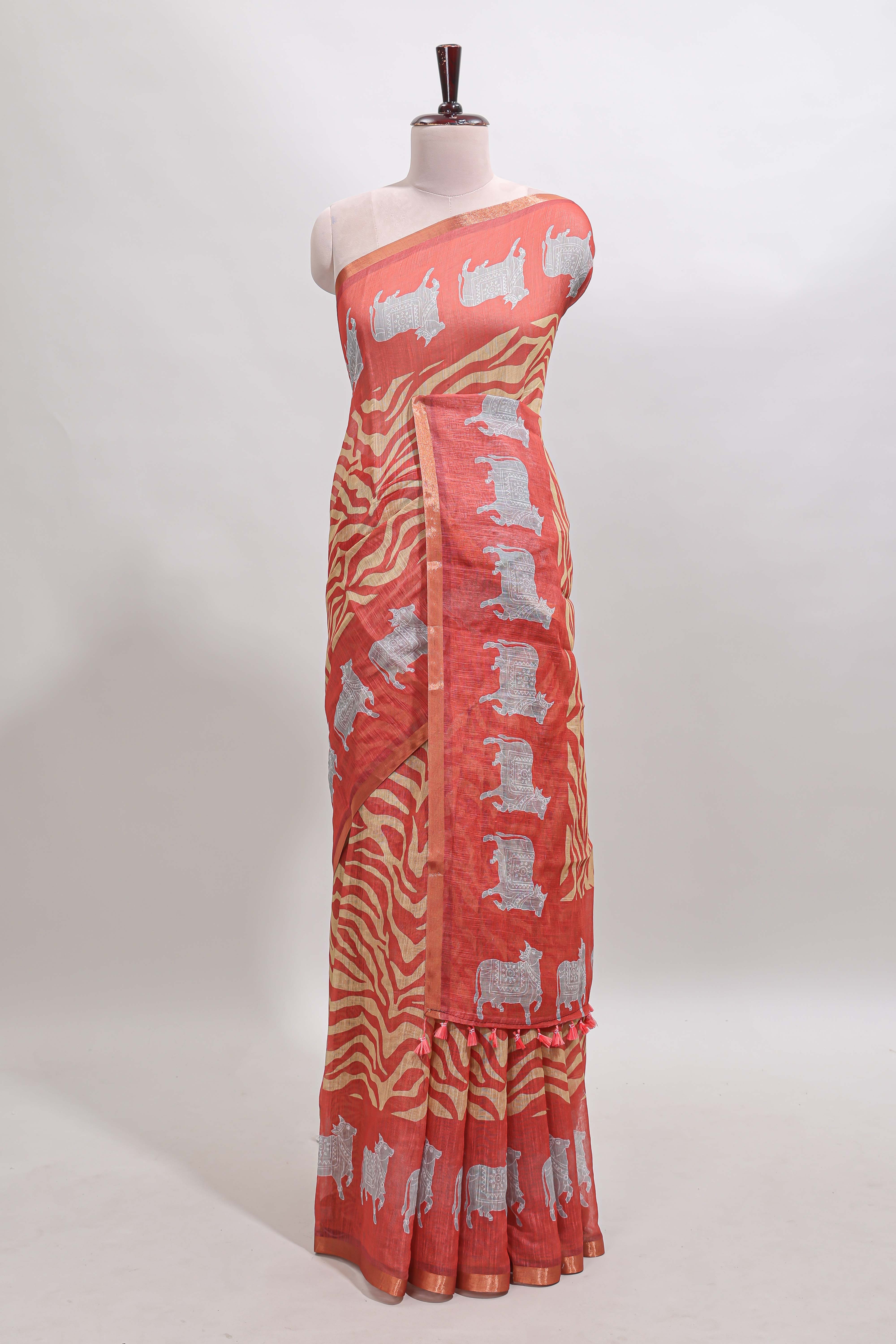 Orange pichwai cow prints & Zebra inspired pattern linen cotton saree with self zari border and matching blouse