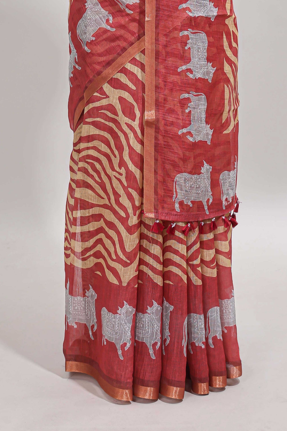 Peach pichwai cow prints & Zebra inspired pattern linen cotton saree with self zari border and matching blouse