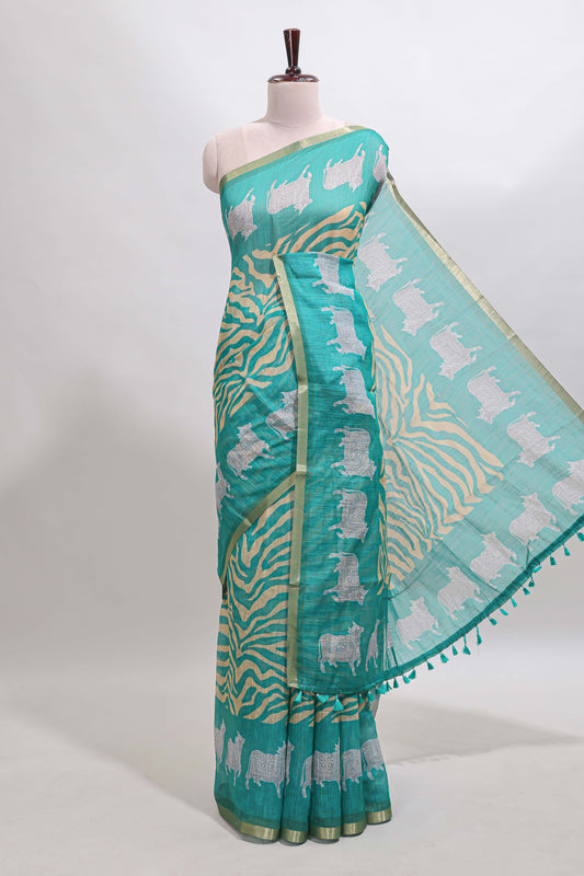 Turquoise green pichwai cow prints & Zebra inspired pattern linen cotton saree with self zari border and matching blouse