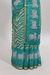 Turquoise green pichwai cow prints & Zebra inspired pattern linen cotton saree with self zari border and matching blouse