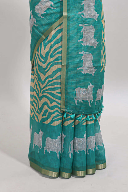 Turquoise green pichwai cow prints & Zebra inspired pattern linen cotton saree with self zari border and matching blouse