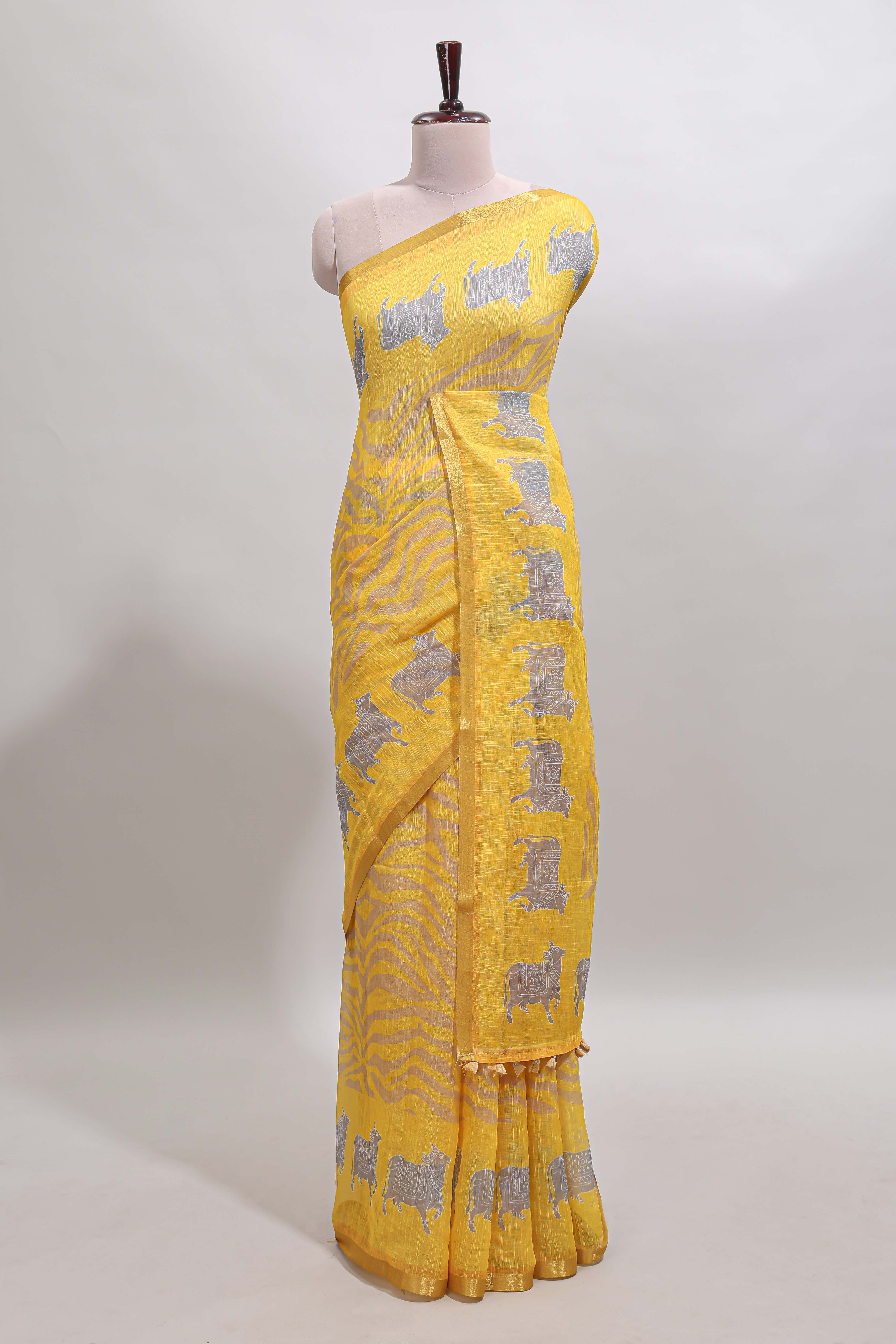 Yellow pichwai cow prints & Zebra inspired pattern linen cotton saree with self zari border and matching blouse
