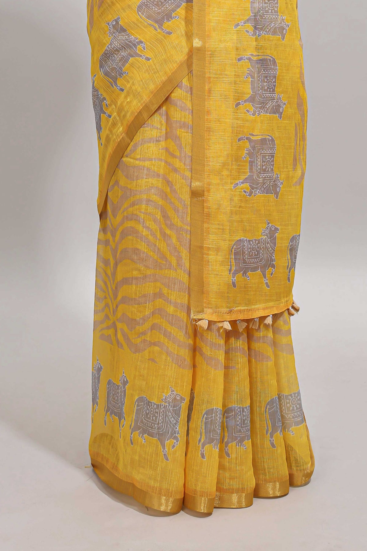 Yellow pichwai cow prints & Zebra inspired pattern linen cotton saree with self zari border and matching blouse