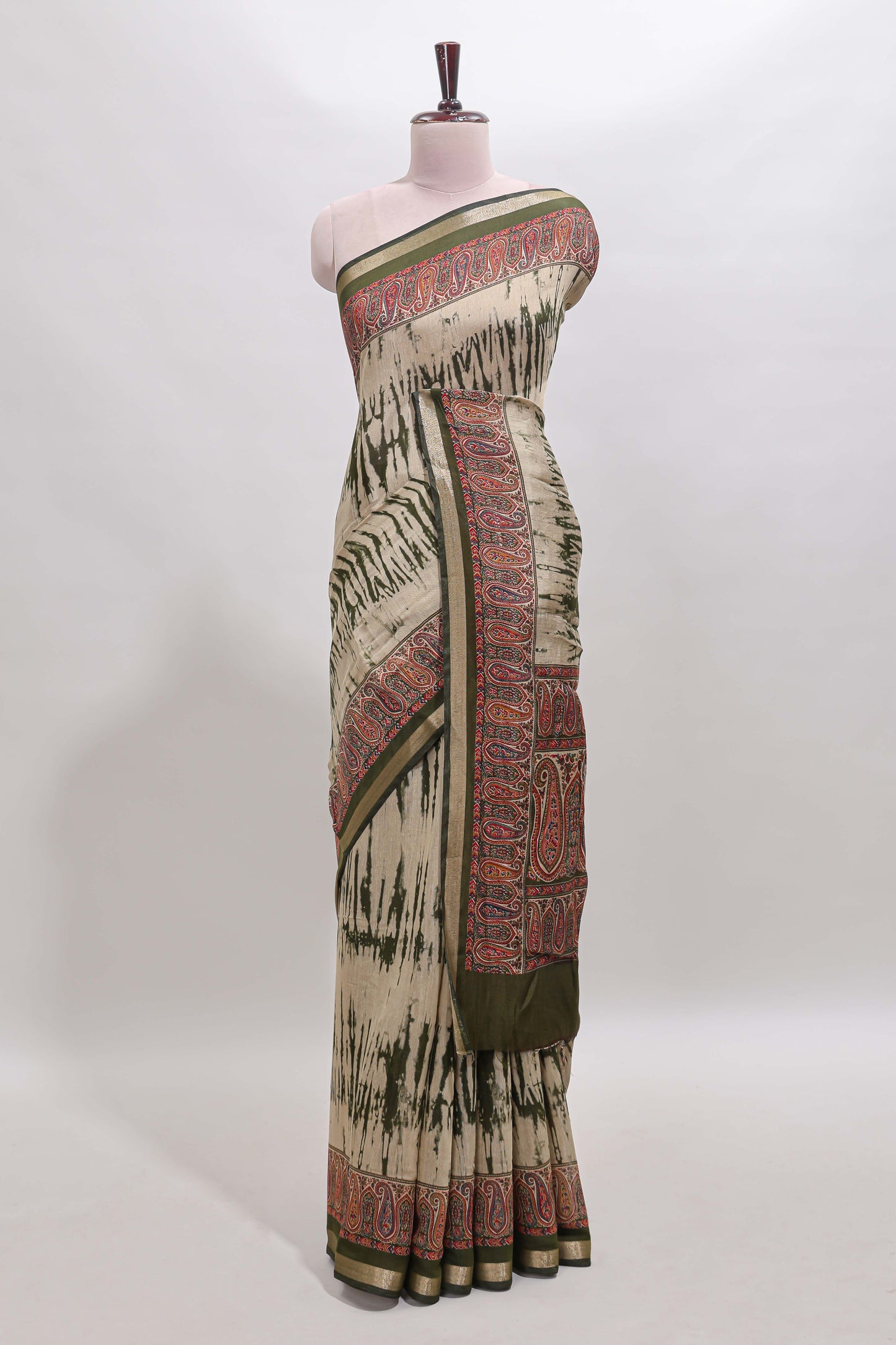 Brown shibori print linen cotton saree with contrast green zari border and printed blouse
