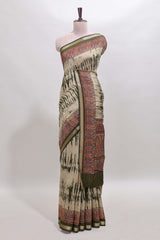 Brown shibori print linen cotton saree with contrast green zari border and printed blouse