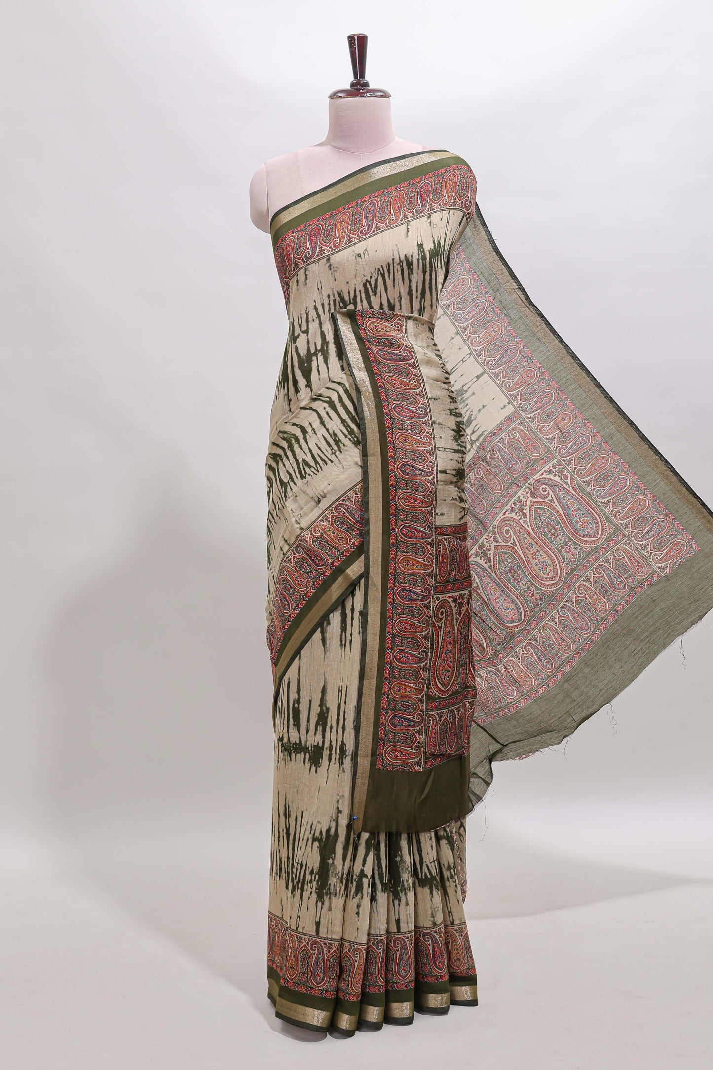 Brown shibori print linen cotton saree with contrast green zari border and printed blouse