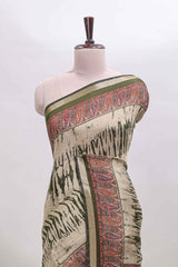 Brown shibori print linen cotton saree with contrast green zari border and printed blouse