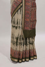 Brown shibori print linen cotton saree with contrast green zari border and printed blouse