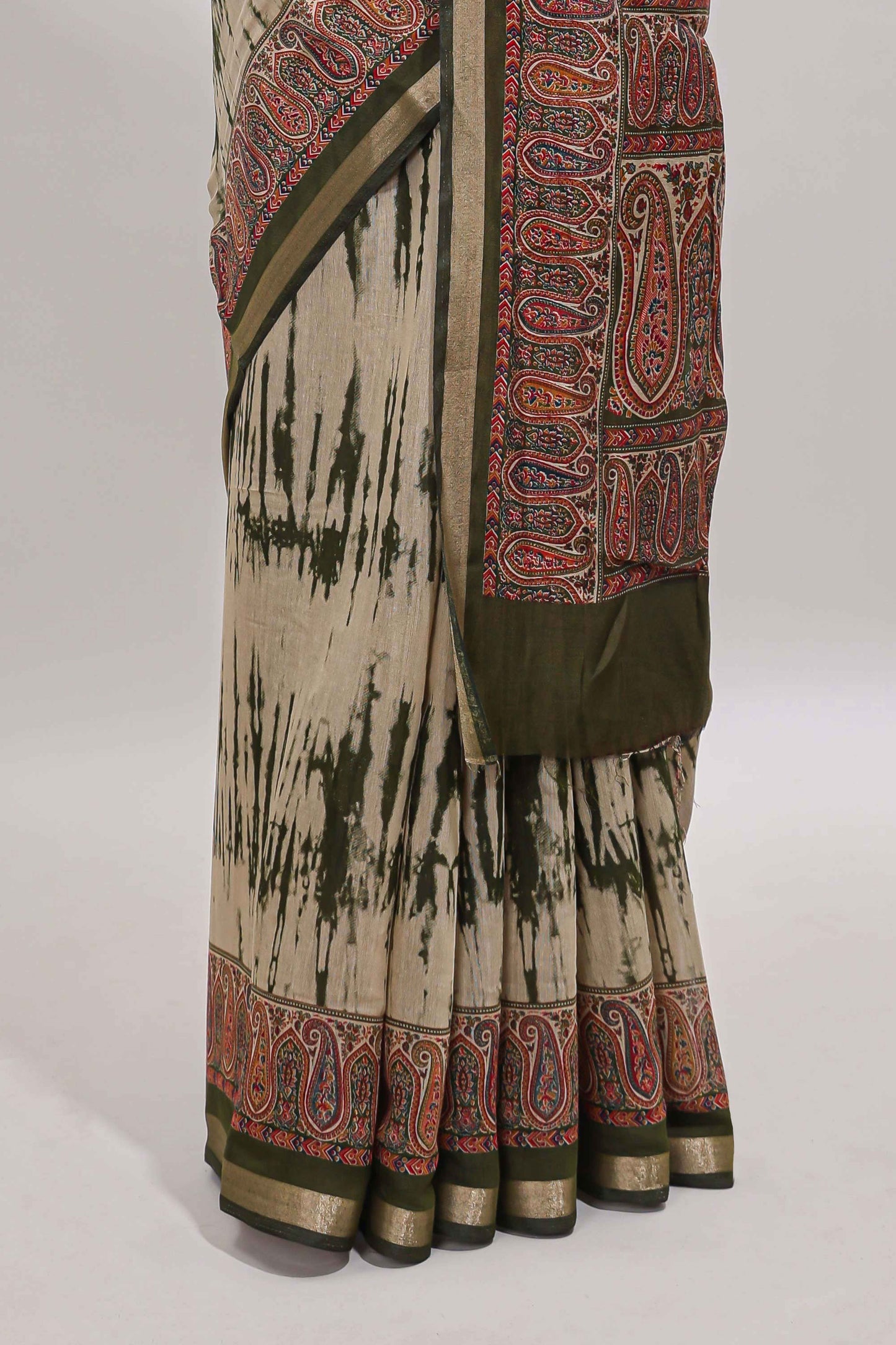 Brown shibori print linen cotton saree with contrast green zari border and printed blouse