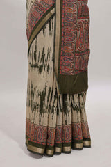 Brown shibori print linen cotton saree with contrast green zari border and printed blouse