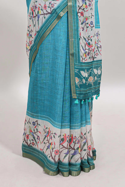 Turquoise green floral & bird motif bottom with checked body linen cotton saree, self zari border and matching blouse