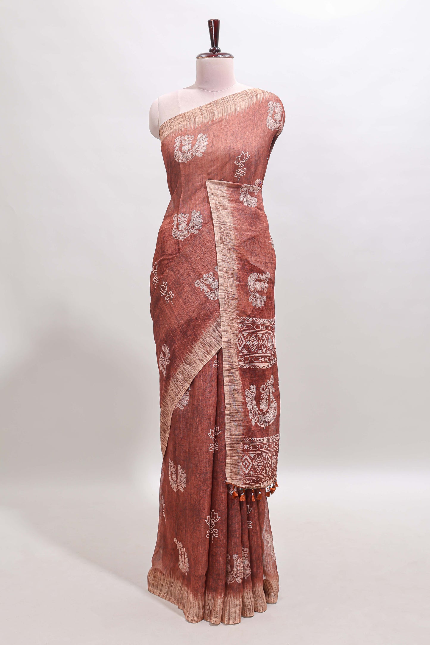 Brown peacock & floral motifs linen cotton saree with contrast border and matching blouse
